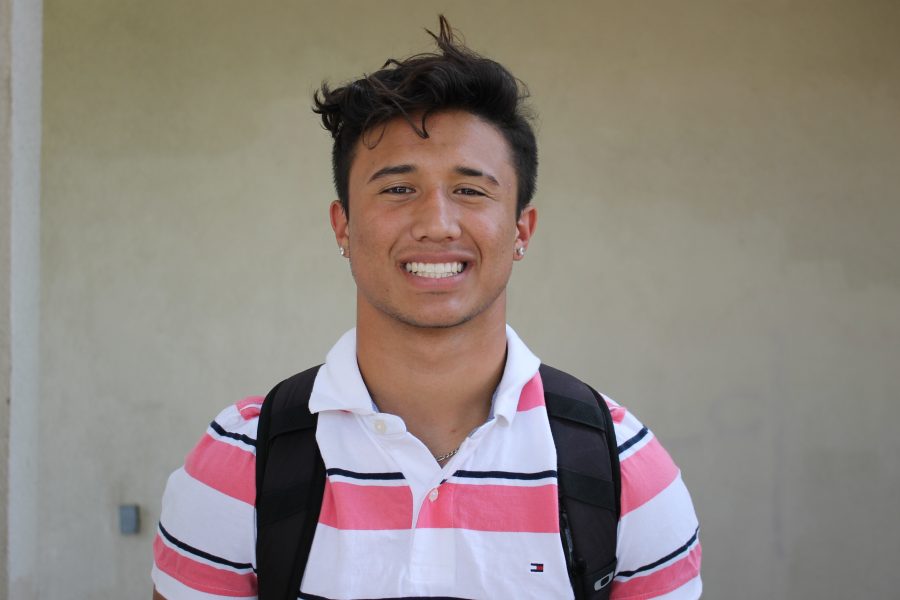 D1-bound athlete, Chuck Wick, practices simling for college admissions photos.