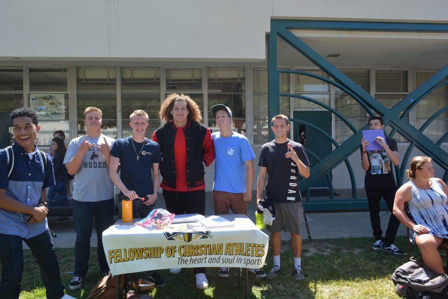 Athletes Brock Peterson, Brian Ferrin, Carlos Aviles, Kai Eigenhuis and Cory Whitcomb hoping to get fellow athletes to sign up for their Fellowship of Christian Athletes Club! Photo by: Hailey Cox