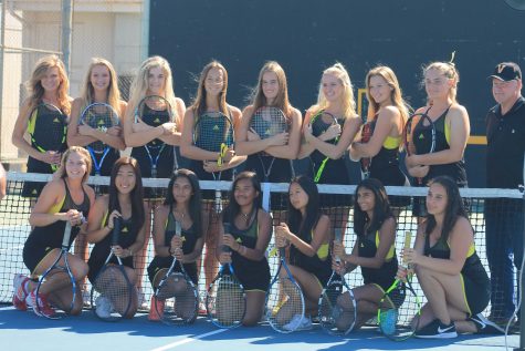 Girls tennis poses for picture day before their match! Photo by: Hailey Cox