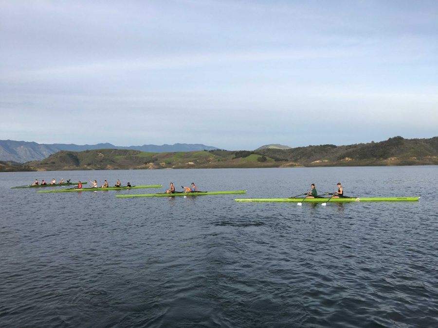 Varsity girls practicing in two fours and two doubles to prepare for their race. Photo by: Sailor Hawes