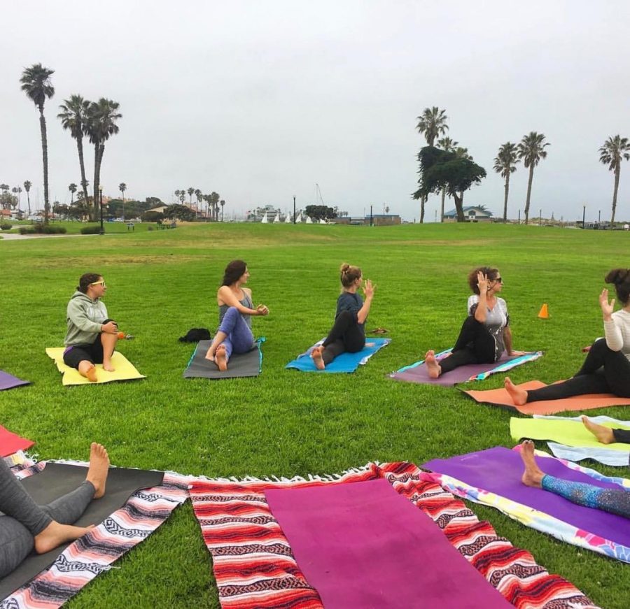 Yoga in the Wild, being practiced at Marina park in  Ventura, CA. Photo from Instagram: @ventura.pop.up.yoga