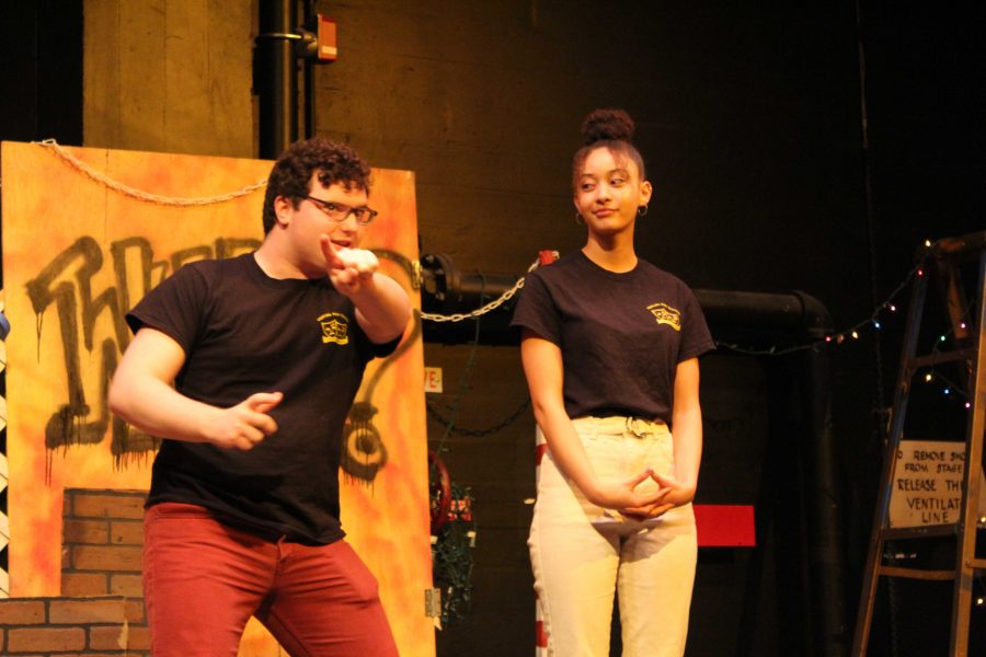 Seniors and Improv Troupe captains, Acacia Harrell and Louis Santia, go over the rules of the show and point out the location of the restrooms before the games begin. Photo by: Miles Bennett