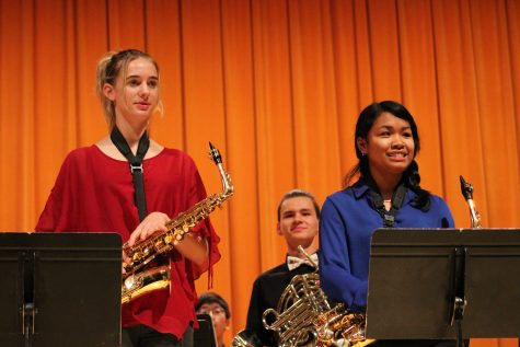 Robinson (left), senior Jonathan van Hyning (middle) and Matthews (right) stand for a round of applause. Studio Jazz Ensemble pianist junior India Hill (not pictured) said,