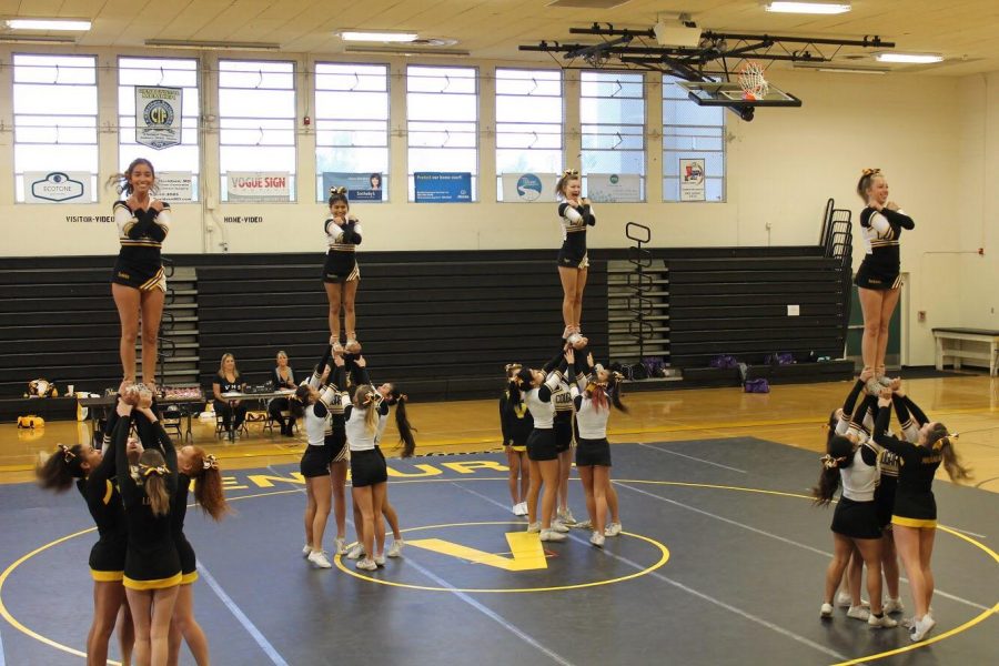 Ventura cheer doing a stunt called a half-down in their routine. Photo by: Josie Dowell