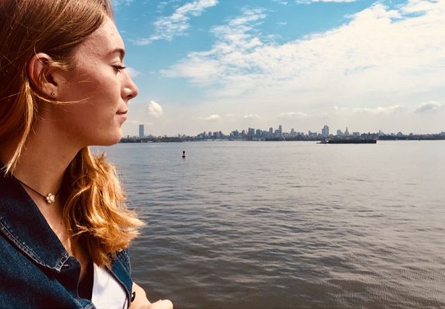 Senior Sammy Pedersen looks out on New York City from the Staten Island Ferry. Photo from Instagram: @samanthaa.christine