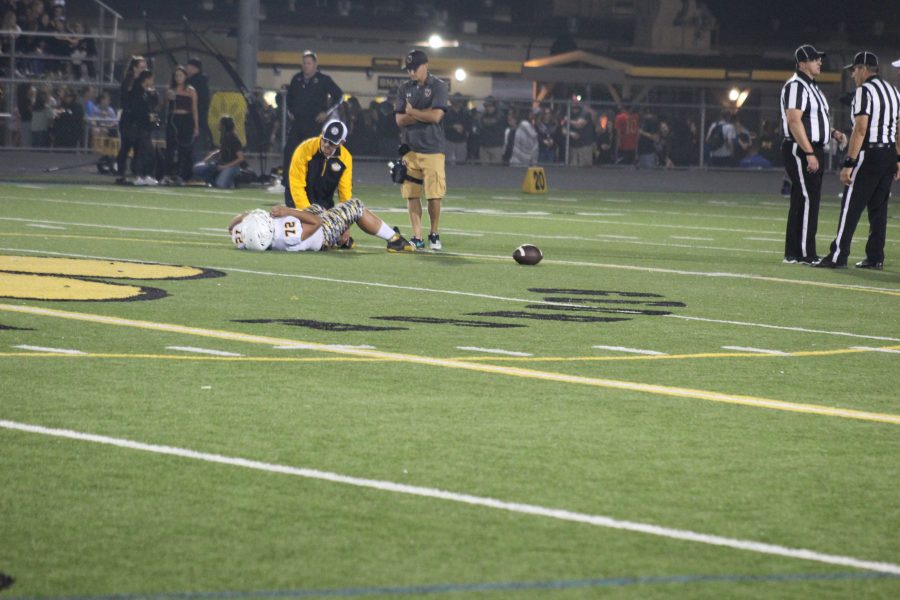 With 2:31 left in the first half, sophomore Caleb Barajas (number 72) went down with an apparent ankle injury.  Photo by: Gavin Cross