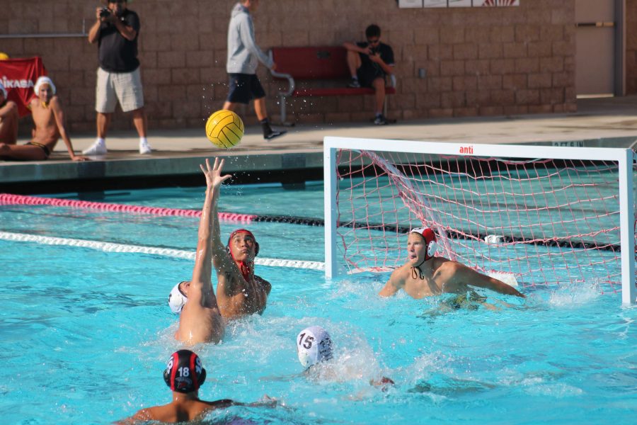 Senior Makoa Gutierrez (number four) tipping the ball away on an attempted pass by the Spartans. Photo by: Greysen Sjoquist