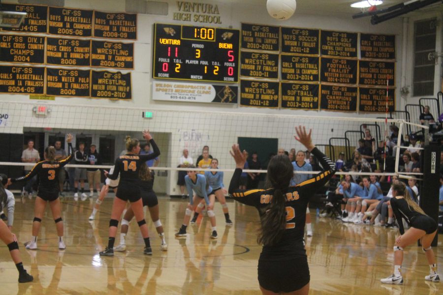 Senior Tatum Teel (number five) serving against Buena. Photo by: John Studebaker