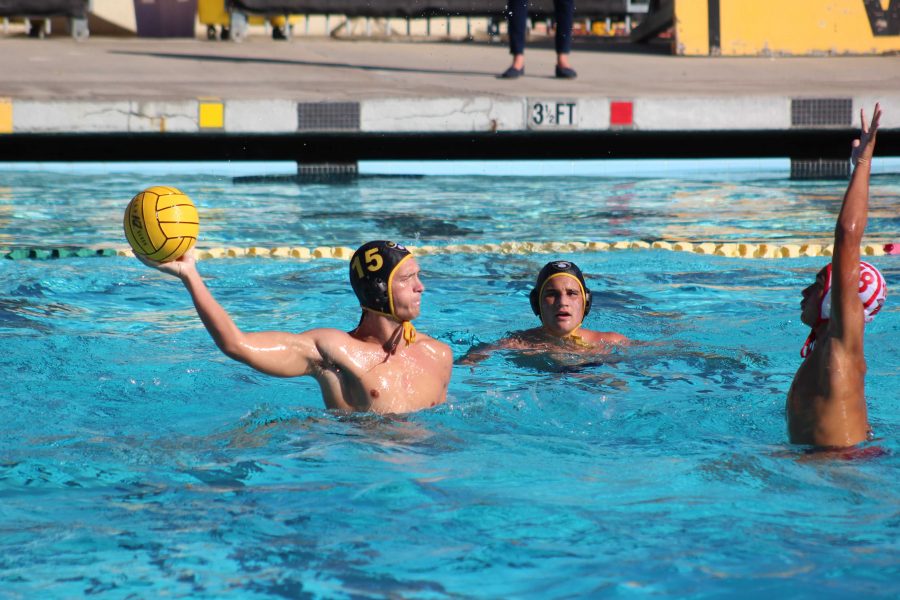 Junior Micah Amico (number 15) pumping back for a pass. Photo By: Gavin Cross