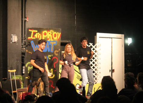Senior Omar Al Bawab, sophomore Jaidyn Sellers, and senior Sam Coats performing a game named