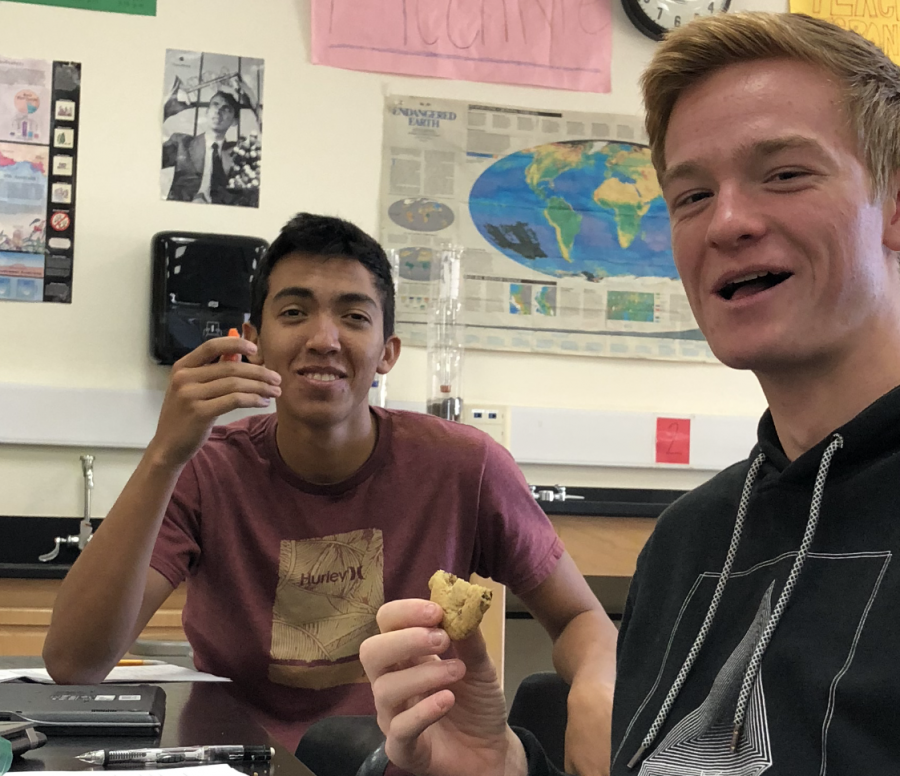 Juniors Omar Espinoza (left) and Nathan Johnson (right) both enjoy a snack in Mr. McEntyres class, a teacher that allows them to eat while learning. Photo by Tatum Luoma