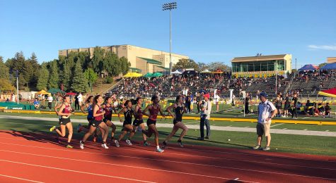 Seniors Alison Tolusa and Cassidy Hubert were running hard, keeping up with the pack towards the end of the race. Photo By: Tatum Luoma