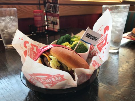 The Impossible Burger is advertised at Red Robin, and it marked when served with a little flag labeled Impossible to remind everyone that it is not, in fact, a meat burger. Photo by: Micah Wilcox