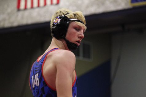 Senior Jacob Yale trying to pin his opponent with an outside single move. Photo By: Luc Le Vasseur