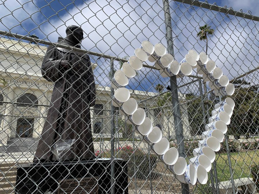 Various anti-removal protestors decorated the fence in support of Serra. I wish there was more awareness of how important of a role the Native Americans had in creating this community and this country, stated junior Carmen Ibarra. Photo by: Anna Guerra