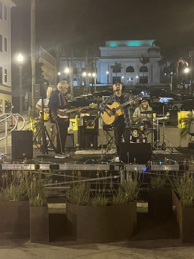 Local performer J Peter Boles playing with his band on Main Street on Saturday, Oct. 10. Boles is a musical veteran whos played a large variety of self-written folk songs for over 22 years. Photo by: Joseph Lombardo 