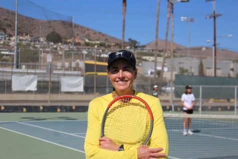  On top of teaching the girls VHS tennis team Allison Ferguson also has a podcast called Empowering Women Through Sports available on Spotify. Photo by: Jade Buck