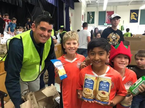 In 2019 at Buena High Schools cafeteria, a soccer team gathered to pack boxes. (Left to right) Matt Almaraz, Bryce, Nathan, and Jenner Photo by: VUSD staff
