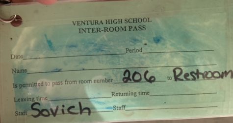 The new bathroom pass for Schatzi Sovichs classroom. By placing a layer of tape over it and adding a lanyard, this paper passed can be reused for multiple students. Photo by: Ava Mohror