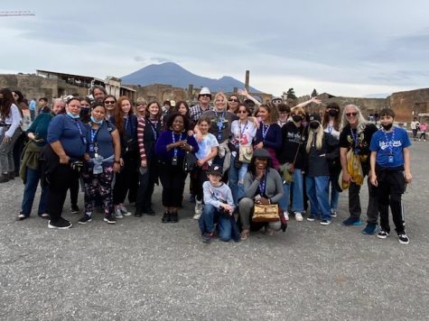 The group of art students and chaperones on the field trip, posed in front of the infamous Colosseum. Photo by: Lauren Minadeo 