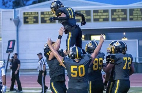 Tobias Raymond 23 (lower-left) said, My favorite memory is throwing Sawyer Cline 24 [#17] in the air after a touchdown. Photo by: Felix Cortez