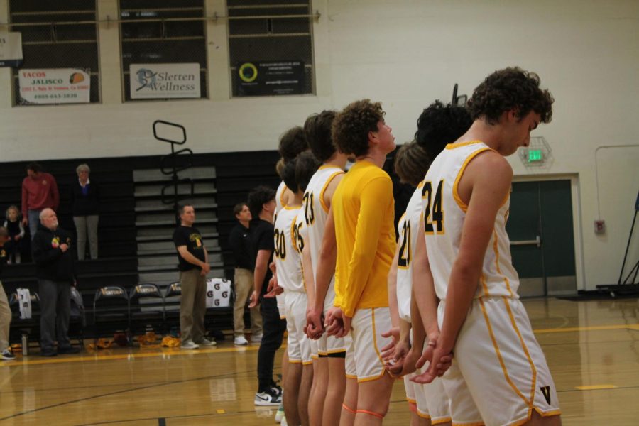 The Ventura High School Boys’ Varsity Basketball Team lined up for the pledge of allegiance at their first Pacific View league game of the season against Pacifica High School at 7 p.m. Dec. 5. Photo by: Kendall Garcia
