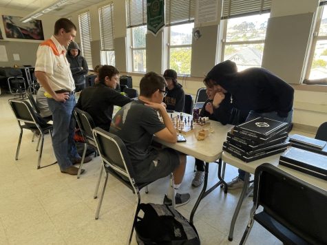 Chess Club President Riley Simpson 24 (upper-left) said, “I started the Chess Club because I like chess. It’s fun to play a good game with somebody. It’s just a big game of cat and mouse.” Photo by: Alejandro Hernandez