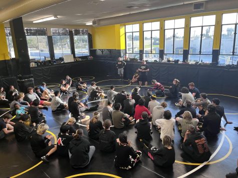 Ventura High School Wrestling Coach Michael Gacha gives the wrestling team a pep talk before practice. Photo by: Lia Hersh
