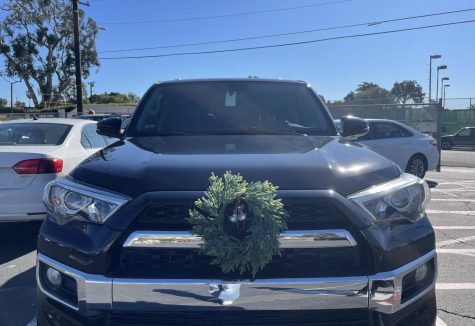 Car decorations come in many forms. Pictured is a VHS student, Fletcher Freemans 23 car with a holiday wreath on the front. Photo by: Belen Hibbler
