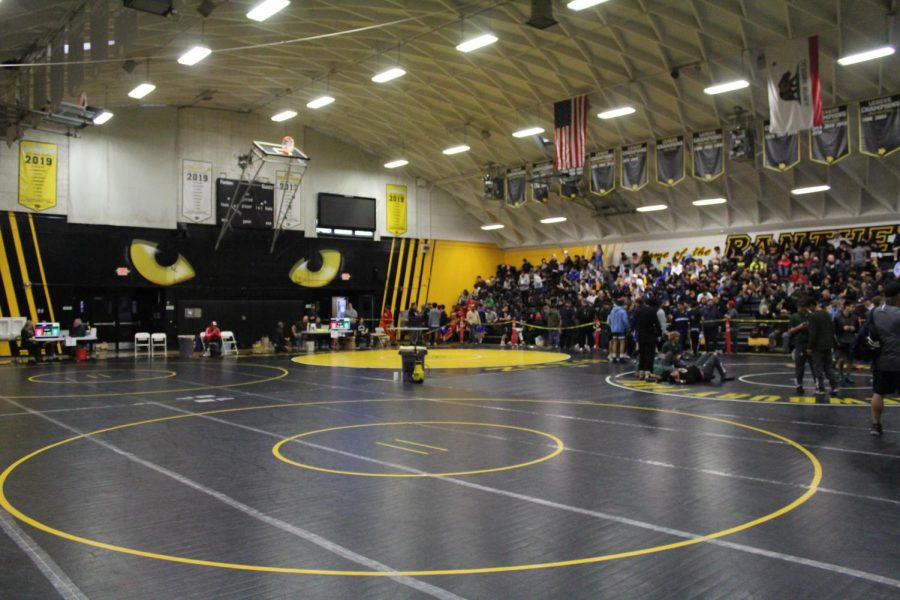 The 41st Annual Newbury Park Invitational wrestling tournament took place at Newbury Park High School on Saturday, Dec. 3 2022 and began at 9 a.m. Boys varsity wrestling team captain Adrian Opolka ‘23 said, “The tournament gave us a good look at other schools and showed us what we need to work on.” Photo by: Hugh Murphy