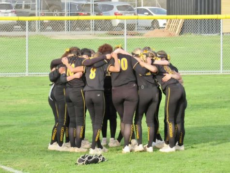 VHS players huddle together before winning the rivalry game. Photo by: Caity Pira