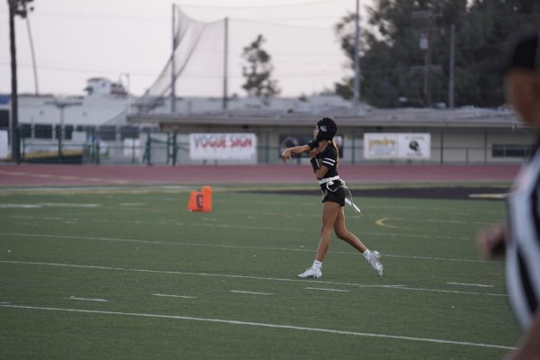Quarterback Ava Ortman 26 completes a pass during a game against Dos Pueblos High School. Photo by: Angel Quiroz