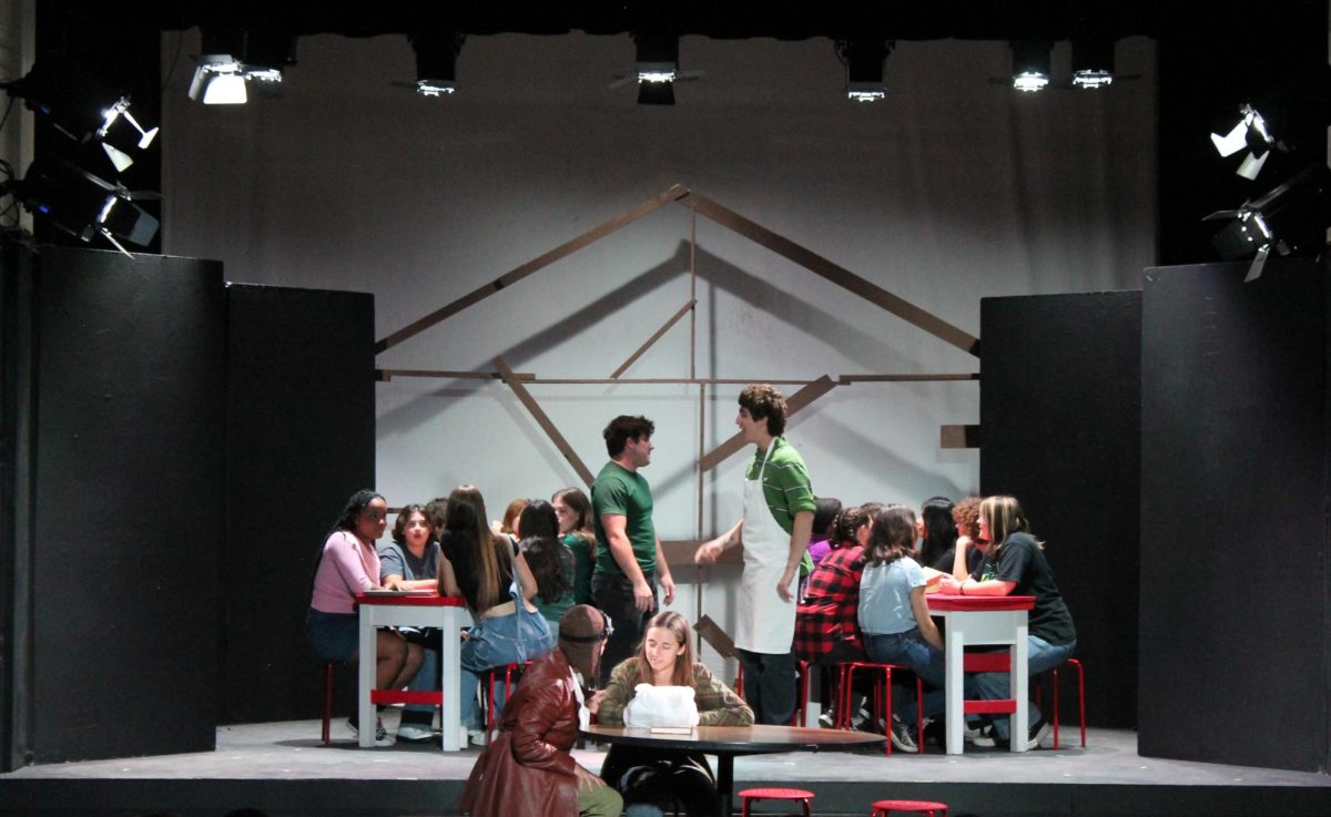Pictured is the lunchroom scene in the play, Discovering Amelia. Bottom left to right, Penelope De Soto and Maja Deboer. Top left to right, Cayden Thomas and Levi Gargoyle. Photo by: Alexis Segovia