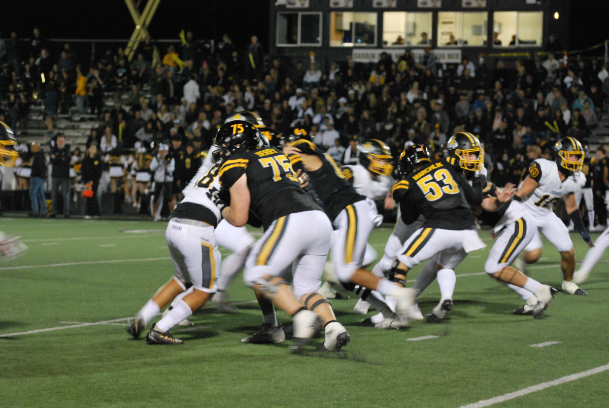 VHS blocks NPHS while on offense to allow VHS to gain yards. Photo by: Brynn Kightlinger
