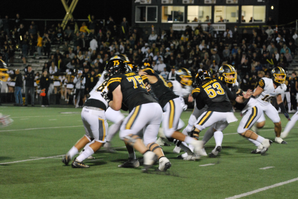 VHS blocks NPHS while on offense to allow VHS to gain yards. Photo by: Brynn Kightlinger