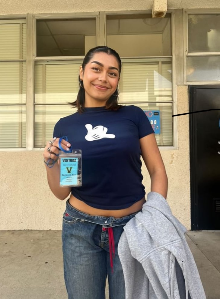 Marissa Peña 25 using her bathroom pass to go to the girls 50/60s wing bathroom. The passes are color coded according to which bathroom is closest to your class. Picture by: Emily Sevaaetasi