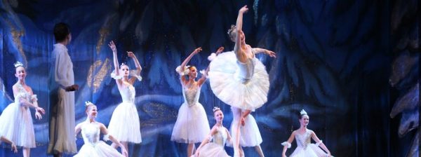 In the opening scene of Snow Scene, Ava Mohror ‘24 (center) dances as the Snow Queen, welcoming Clara to her kingdom. Photo by: Sophia Denzler

