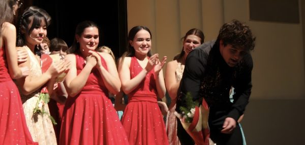 After Houses closing speech, long standing show choir members were given flowers as a parting gift from House. Photo by: Emily Sevaaetasi
