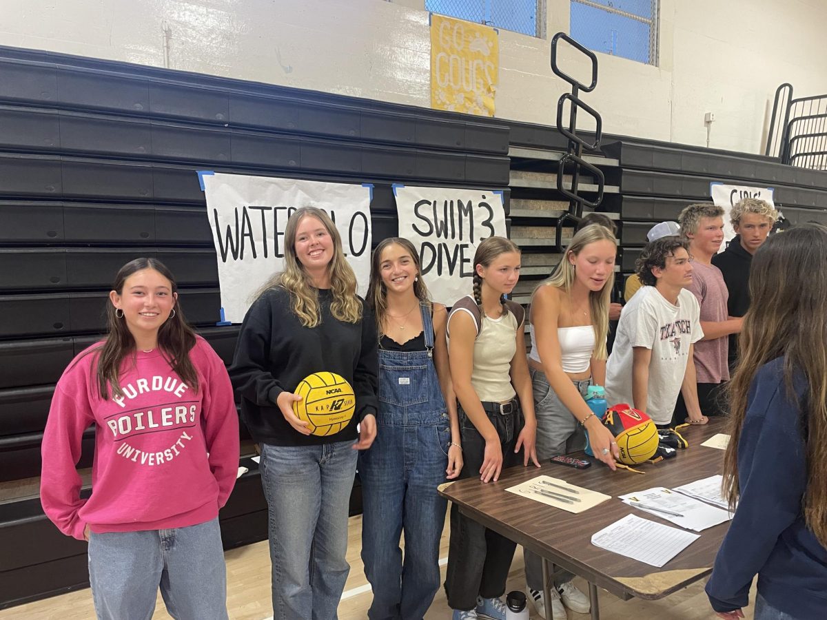 The girls and boys water polo team were at their table talking to incoming freshmen. Photo by: Lily Brown
