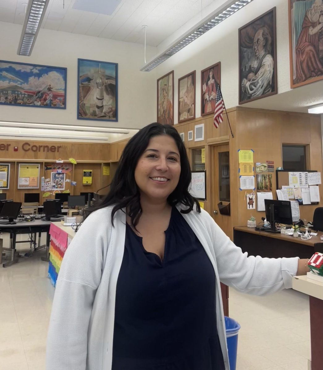 "I love students and education and teaching, and as a librarian, you get to see all the grades, and that's what I love the most," said Farima Farokhi, the new librarian at VHS. Photo by: Brynn Kightlinger
