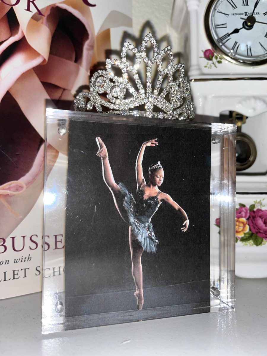 A Ballet memento to Michaela DePrince. The picture in the glass is of DePrince as she danced in a Black Swan tutu from the ballet Swan Lake. Even though she passed, her pictures and books will continue to inspire girls from around the world. Photo by: Brie Cheatham
