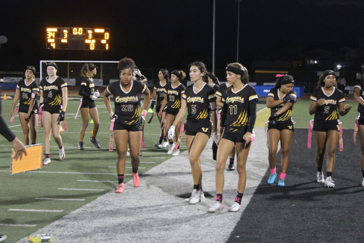 The flag football team going to discuss strategies for the second half after the first half ended with a score of 34-0. Photo by: Samantha Martinez
