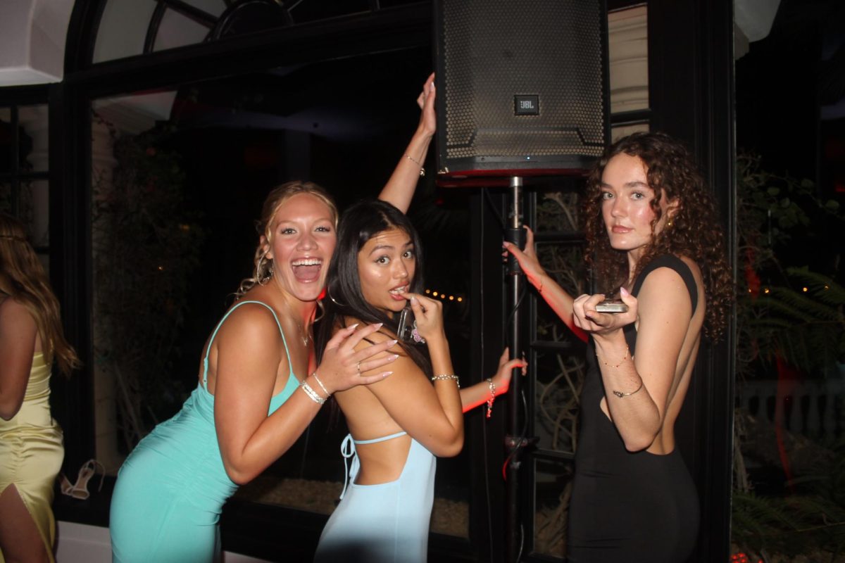 From left to right: Isabella Coleman ‘25, Chyna Wong-Wui ‘25 and Sadie Engelhardt ‘25 being one of the first on the dance floor, next to the speaker. Photo by: Natalie Di Silvestro
