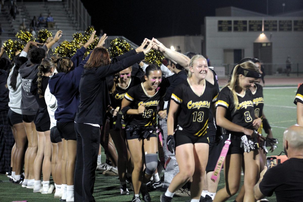 A tunnel was formed by JV players, parents, teachers and fans to celebrate the girls after their win against cross town rivals Buena High School. Photo by: Samantha Martinez