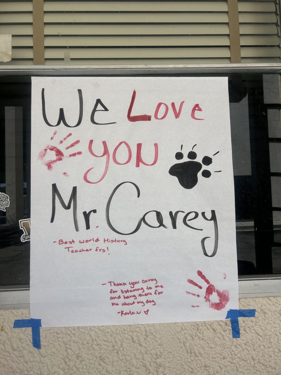 Students show appreciation for Craig Carey by hanging up a sign outside his classroom. Photo by: Brooklyn Delgado