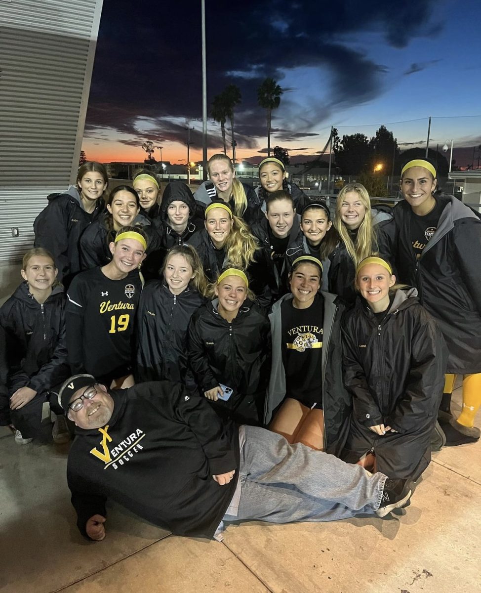 Coach and teacher Todd Tackett with 2022-23 girls' soccer team after their last game against Canyon High School. Photo by: Soraya Stegall